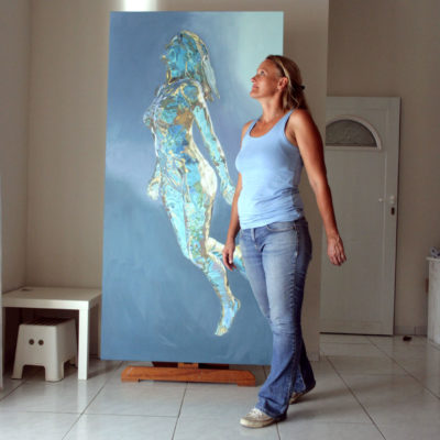 Model in artist's studio, with painting 7 in early progress.